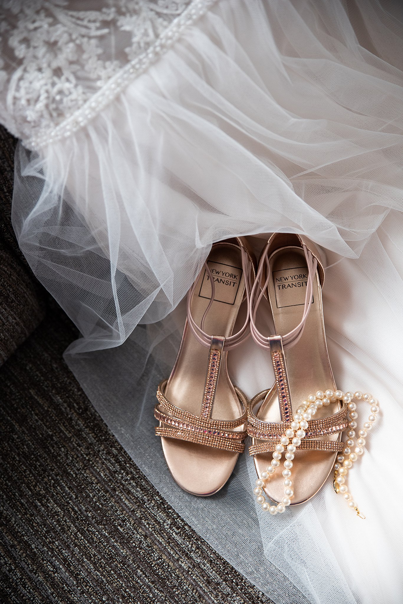 bride's heels on her wedding veil