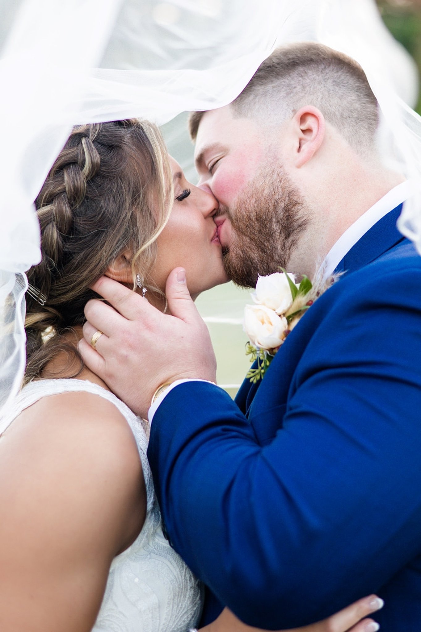 bride kissing her groom at her asa waters mansion wedding