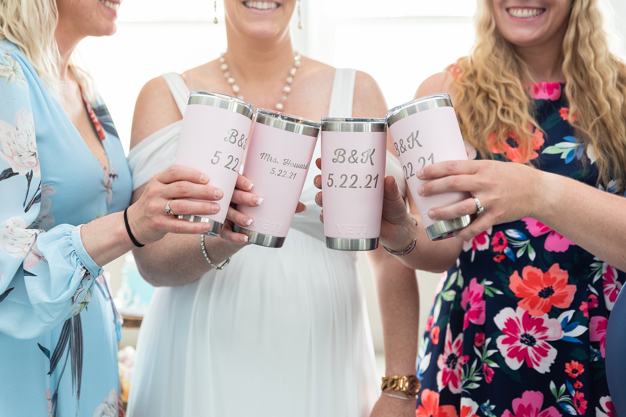 bride with her bridesmaids with their cups together Lake Pearl Wedding