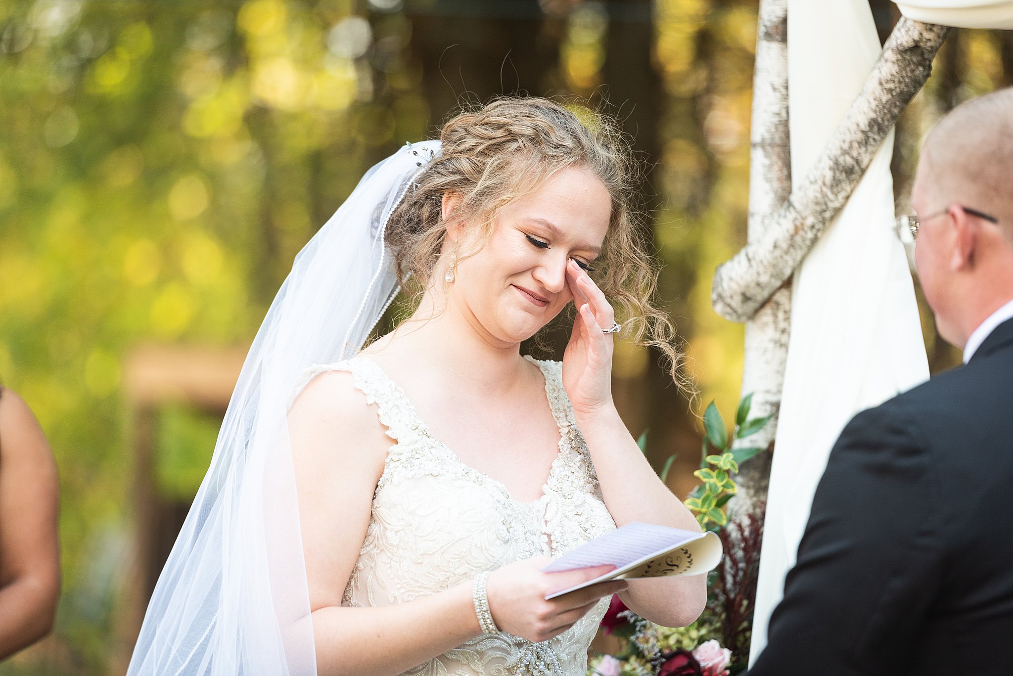 bride shedding a tear during vows at her villa at ridder country club wedding